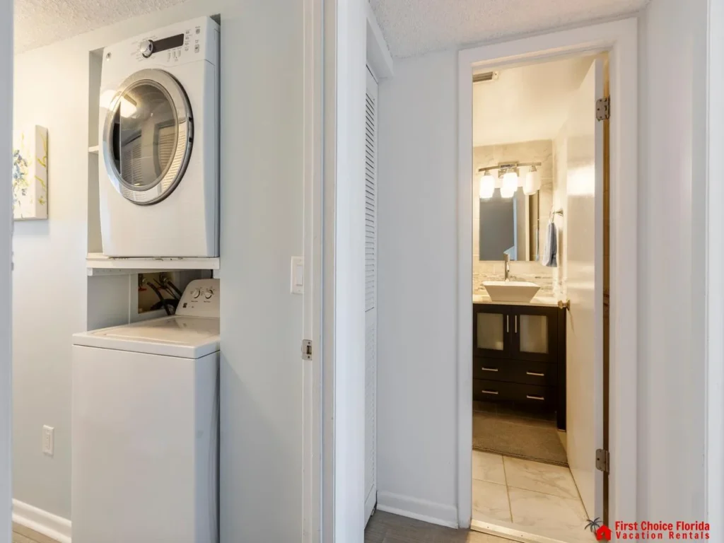 Convenient laundry area adjacent to a modern bathroom
