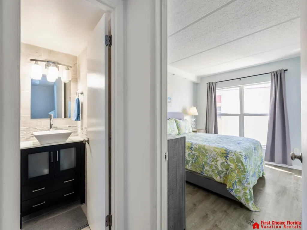 Bright guest bedroom entry with cozy bedding and natural light