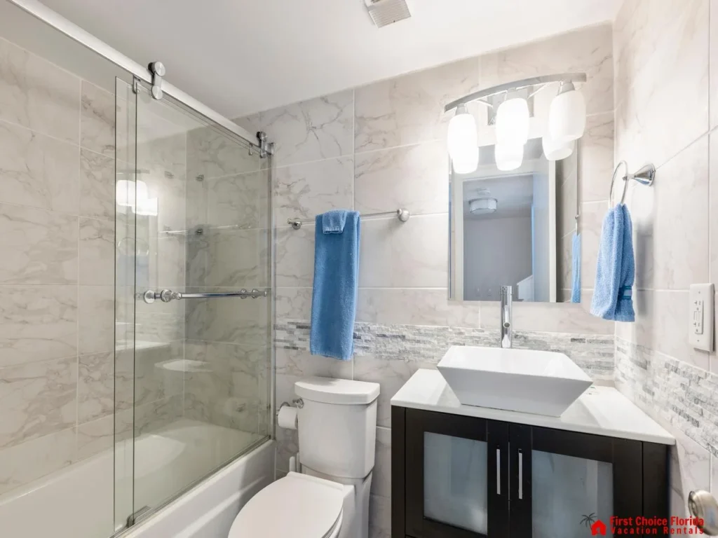Modern bathroom with glass shower and sleek vanity
