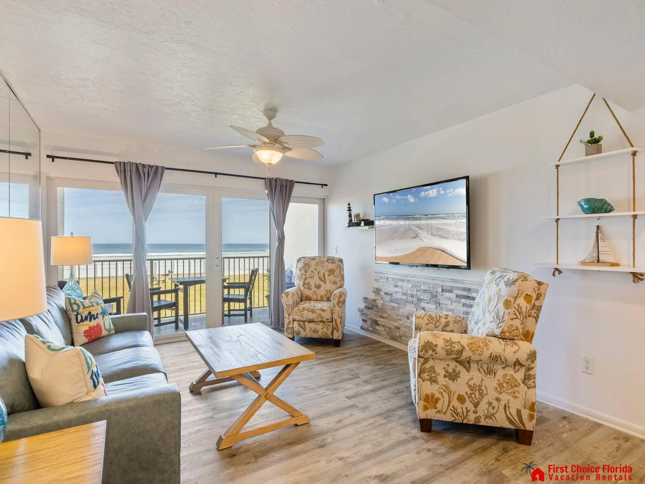 Sunlit living room with ocean views and cozy seating