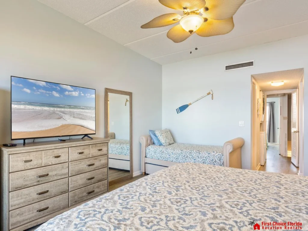 Bright and airy bedroom with coastal-inspired decor and smart TV