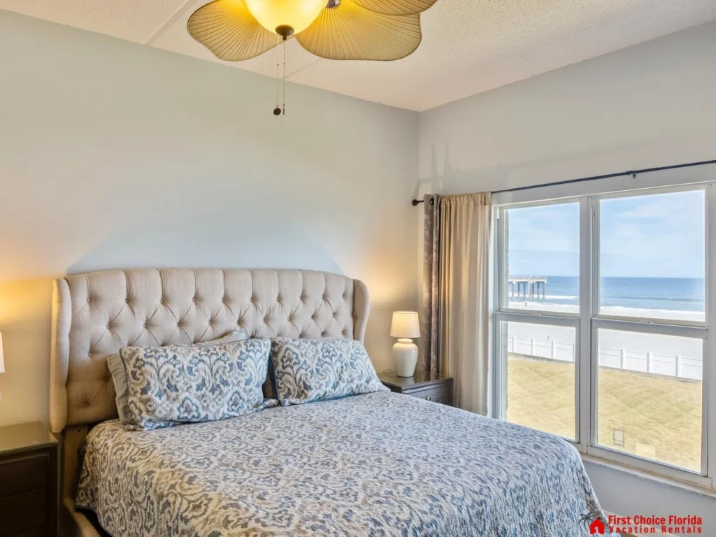 Cozy bedroom with ocean views and natural light