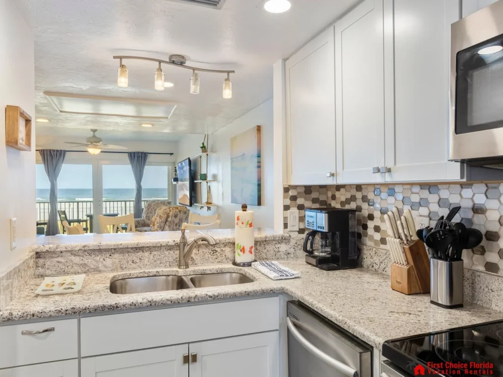 Bright, modern kitchen with ocean views and cozy seating
