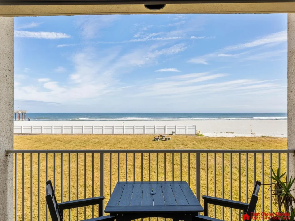 Beachfront balcony with stunning ocean views and cozy seating