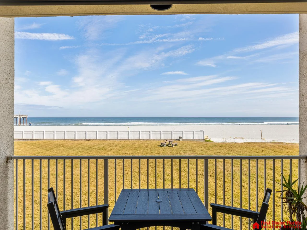 Beachfront balcony with stunning ocean views and cozy seating
