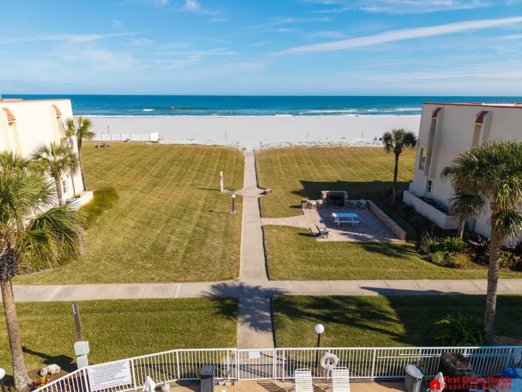 Oceanfront lawn with direct beach access and stunning views
