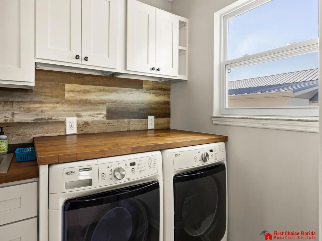 Bright laundry room with modern washer and dryer setup