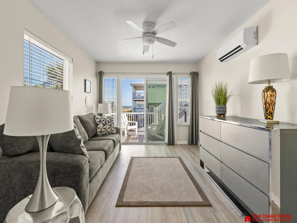 Bright and airy living room with cozy seating and balcony access
