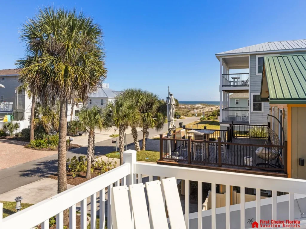Sunny balcony retreat with palm tree views and ocean breeze