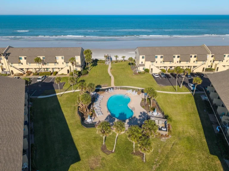 Oceanfront pool and lounge area with stunning beach views