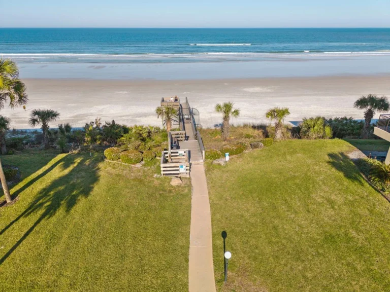 Spacious beachfront lawn with direct ocean access and stunning views!